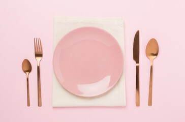 Minimal table setting on color background, top view