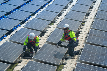 Photovoltaic engineers work on floating photovoltaics. workers Inspect and repair the solar panel equipment floating on water. Engineer working setup Floating solar panels Platform system on the lake.