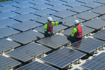 Photovoltaic engineers work on floating photovoltaics. workers Inspect and repair the solar panel equipment floating on water. Engineer working setup Floating solar panels Platform system on the lake.