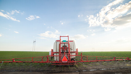 Fototapeta premium Spraying pesticides at soy bean fields