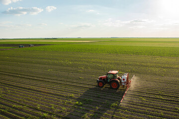 Spraying pesticides at soy bean fields