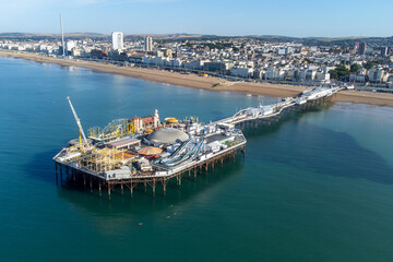 Pier being built over a calm blue ocean: Brighton, West Pier