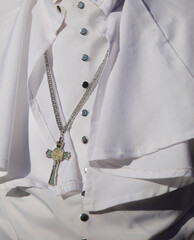White religious cassock worn by the pontiff during ceremonies with the crucifix
