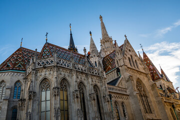 Fototapeta na wymiar Beautiful Mattias Church famous for its colorful roof tiles in Budapest city, Hungary, one of the most famous city landmarks and tourist attractions