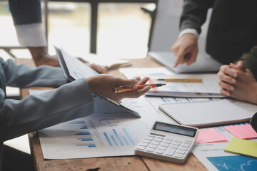 Co working conference, Business team meeting present, investor colleagues discussing new plan financial graph data on office table with laptop and digital tablet, Finance, accounting, investment.