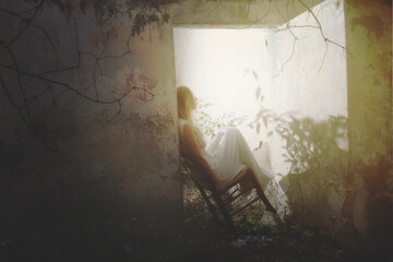 lonely woman swings sitting on the door of a room in an abandoned house, abstract concept