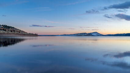 Fototapeta na wymiar calm Carter Lake in northern Colorado in winter scenery at dusk