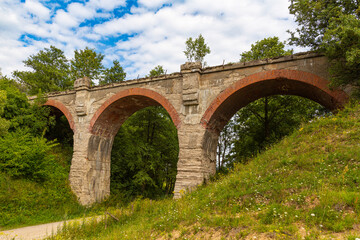 Old railway bridge over the sandy road. Somewhere in northern Poland.