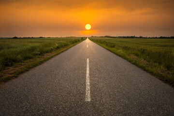 An empty road to meet the beautiful sunset