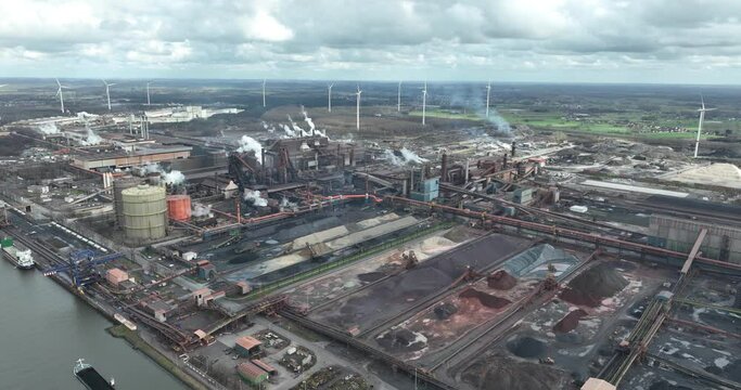 Aerial drone birds eye view on Belgian steelworks situated in Ghent near Zelzate, Flanders. Maritime steel producer.
