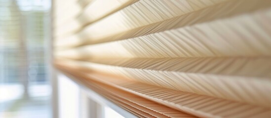Large beige pleated blinds with a 50mm fold, close-up view in interior window openings. Modern privacy shades for apartment windows.