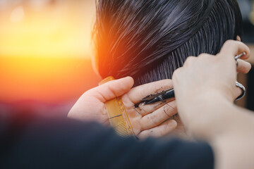 Concept banner Barbershop for man, sunlight. Closeup master hairdresser does hairstyle and style...