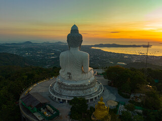 aerial view amazing colorful sky at sunrise in front of Phuket big Buddha..The sun's rays...