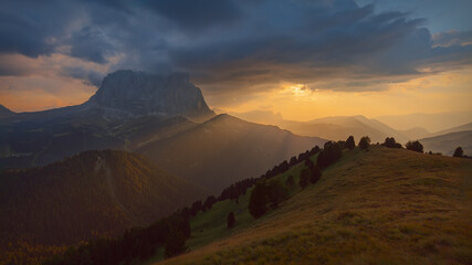 Idyllic nature scenery with mountain peak at beautiful sunset