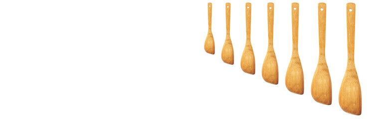 wooden kitchen spatulas on a white background. the concept of working in the kitchen
