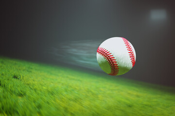 Baseball flying fast through the air in slow motion above the stadium grass