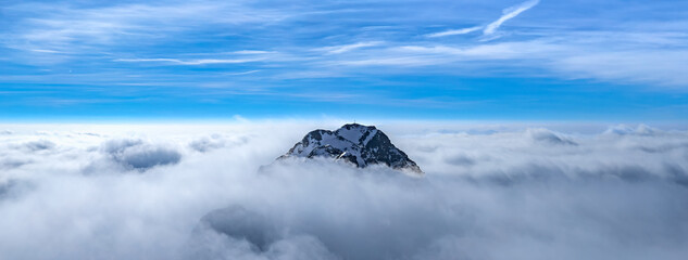 Panoramic view of Mountain Peak surrounded by clouds