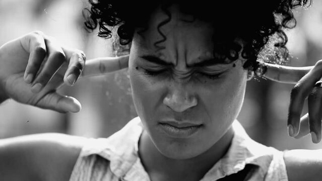 Young Lady Refusing to Listen, Placing Fingers in Ears, Muting External Noise, Dismissive Gesture to Ignore Warnings in black and white