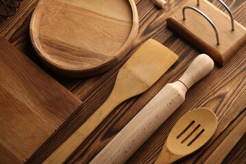 Set of wooden eco kitchen utensils on boards. Flat lay. Top view