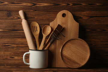 Set of wooden eco kitchen utensils on boards.