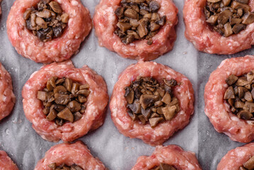 Delicious baked meat boats with mushrooms, cheese, salt and spices