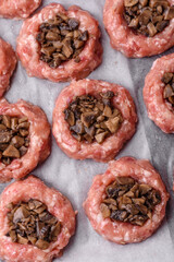 Delicious baked meat boats with mushrooms, cheese, salt and spices