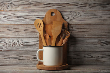 Set of wooden eco kitchen utensils on boards.