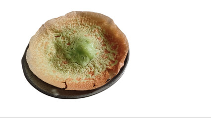 Indonesia Traditional Cake or  Kue Ape on white plate and isolated on white backgroound.
Kue Ape or Serabi Jakarta is a traditional snack from Jakarta