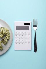 Plate with calculator, measure tape and fork on blue background. Reset evening, count calories