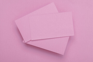 Pink Blank business cards for corporate identity on pink background. Creative mockup.