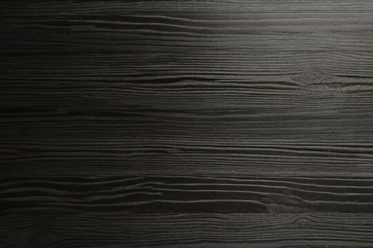 close up of the surface of a black dark flooring wood wall wooden plank board texture background with structures and grains