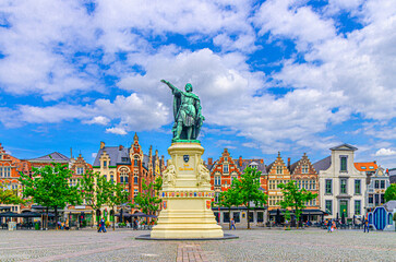 Vrijdagmarkt Friday market square with Jacob van Artevelde statue and old colorful flemish...