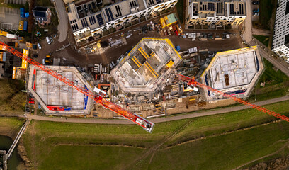 Panorama top down aerial of real estate project Pracht new housing apartment towers construction site part of urban development Noorderhaven neighbourhood