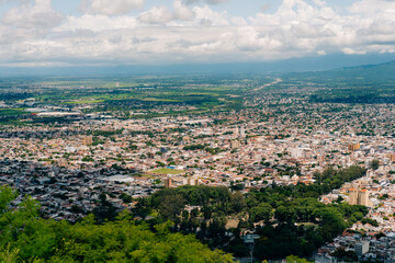 Fototapeta premium Top view of the city, streets and houses with tiled roofs. Salta, Argentina