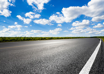 abstract empty road in summer, blue sky, white clouds, highway or speedway in rural countryside created with generative ai technology - obrazy, fototapety, plakaty