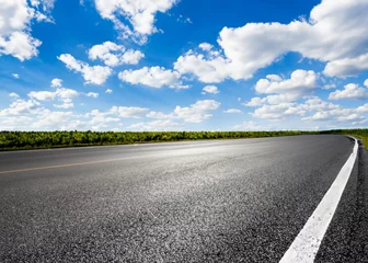 Foto op Canvas abstract empty road in summer, blue sky, white clouds, highway or speedway in rural countryside created with generative ai technology © Alena Yakusheva