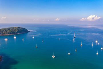 aerial view beautiful blue sky above green sea at Nai Harn beach. .Tourist boats and yachts moored...