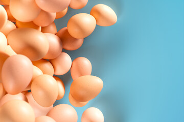 Enigmatic Floating Brown Eggs Against a Serene Blue Pastel Backdrop
