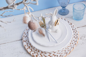 Table place setting with bunny figure and eggs