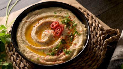 Delicious hummus in ceramic bowl