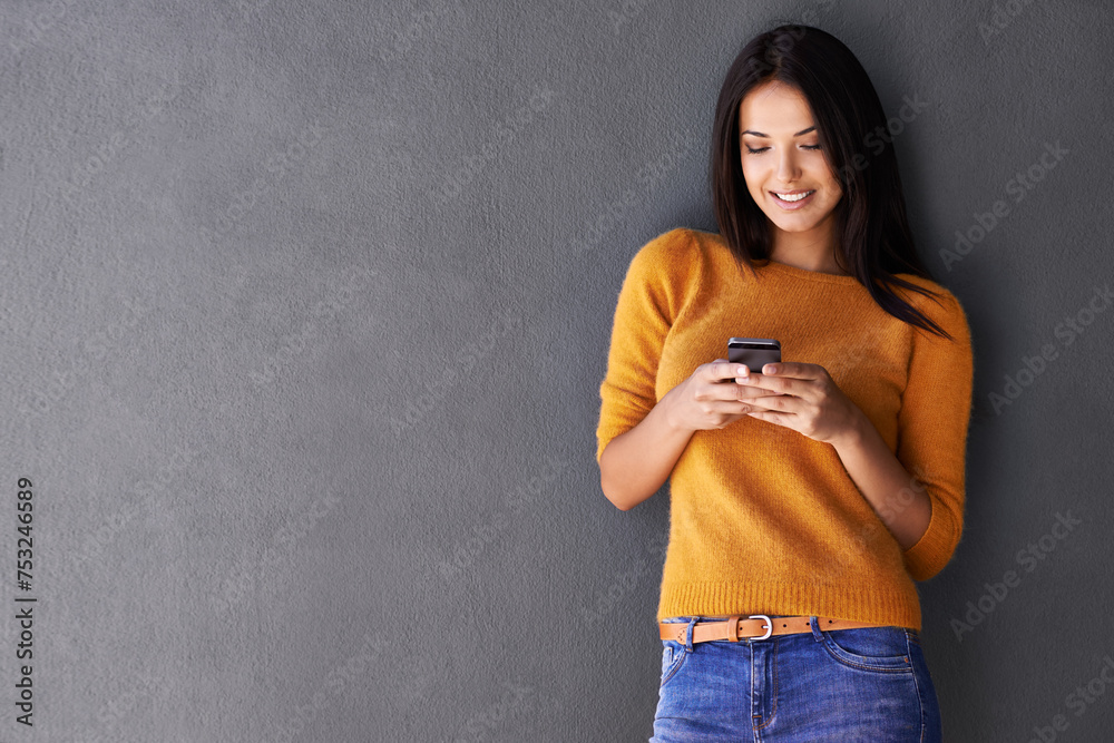 Poster Woman, phone and app for communication in studio, online and blog or reading notification. Female person, smile and scroll or browse on social media, gray background and internet for networking