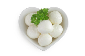 Mini mozzarella balls with parsley in a ceramic bowl isolated on white background. Top view. Flat lay.