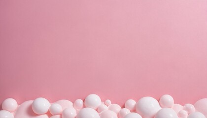 Soft pink background featuring white cleaning foam bubbles, suitable for laundry and cleaning ads