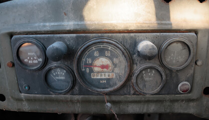 A fragment of the instrument panel, typical of old models of Soviet cars. Inscriptions in Russian...