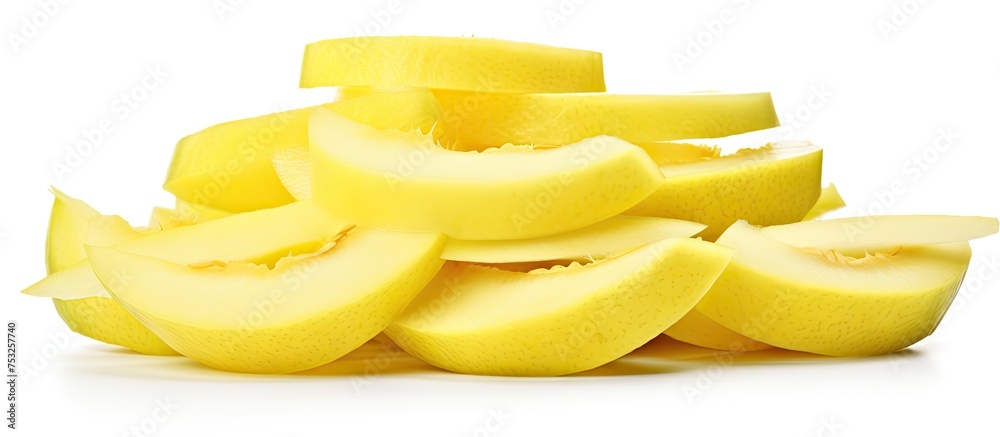 Poster freshly sliced yellow apples piled up on a rustic wooden table in natural light