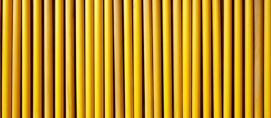 Obraz premium Vibrant Colorful Assortment of Artistic Pencils on a Sunny Yellow Background