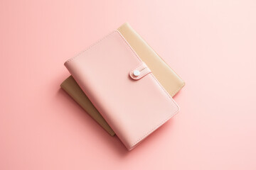 A duo-tone wallet rests on a soft pink surface, exuding minimalist vibes.
