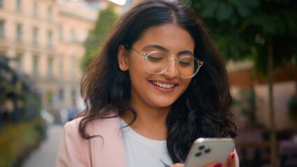 Close up happy smiling teen Indian Arabian ethnic woman girl female businesswoman traveler enjoying...