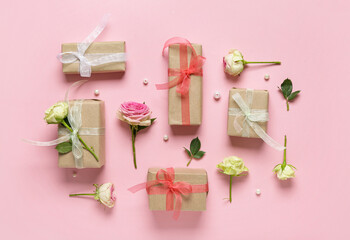 Gift boxes with beautiful roses on pink background. International Women's Day