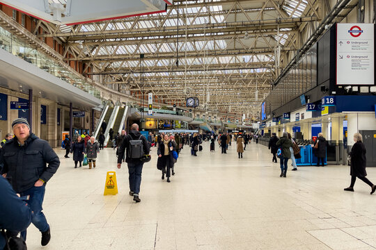 People walking inside Waterloo station in London, England